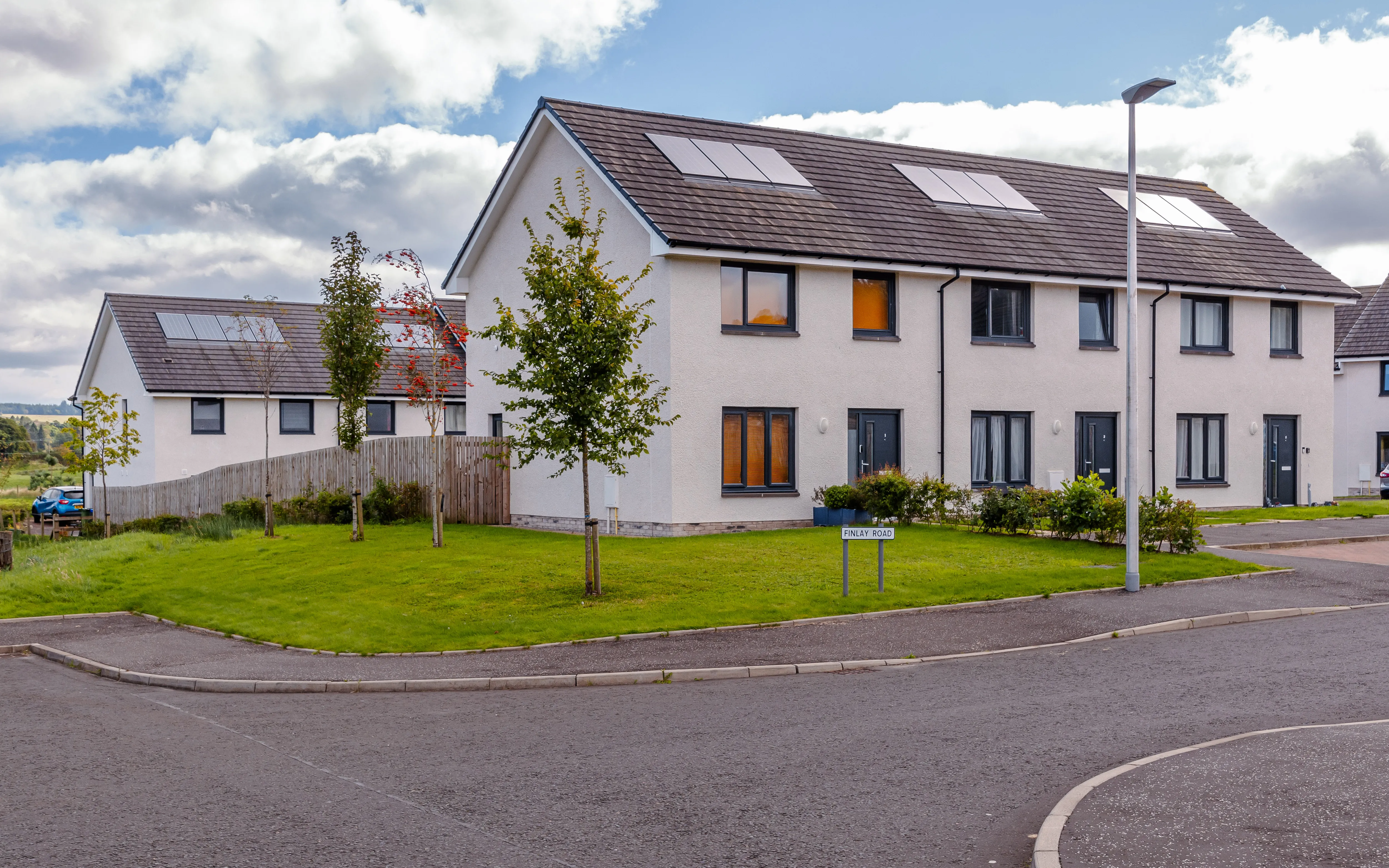 A housing development with grassed area