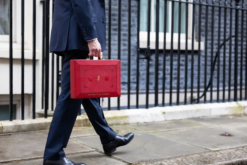 government minister with budget breifcase