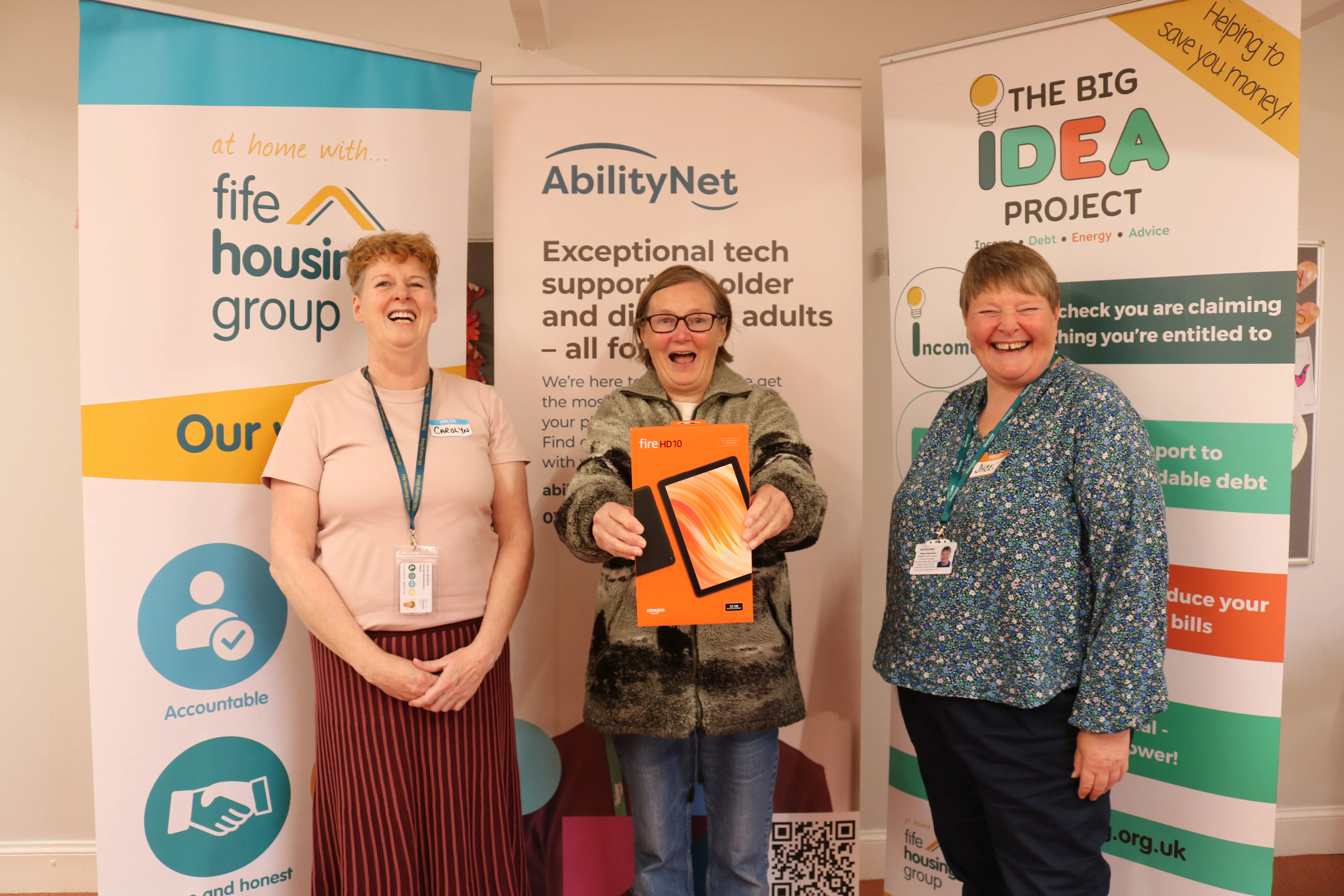 Margaret Bernard shows off her tablet with Carolyn McAllister (Fife HG) and Sheena MacKenzie (AbilityNet)