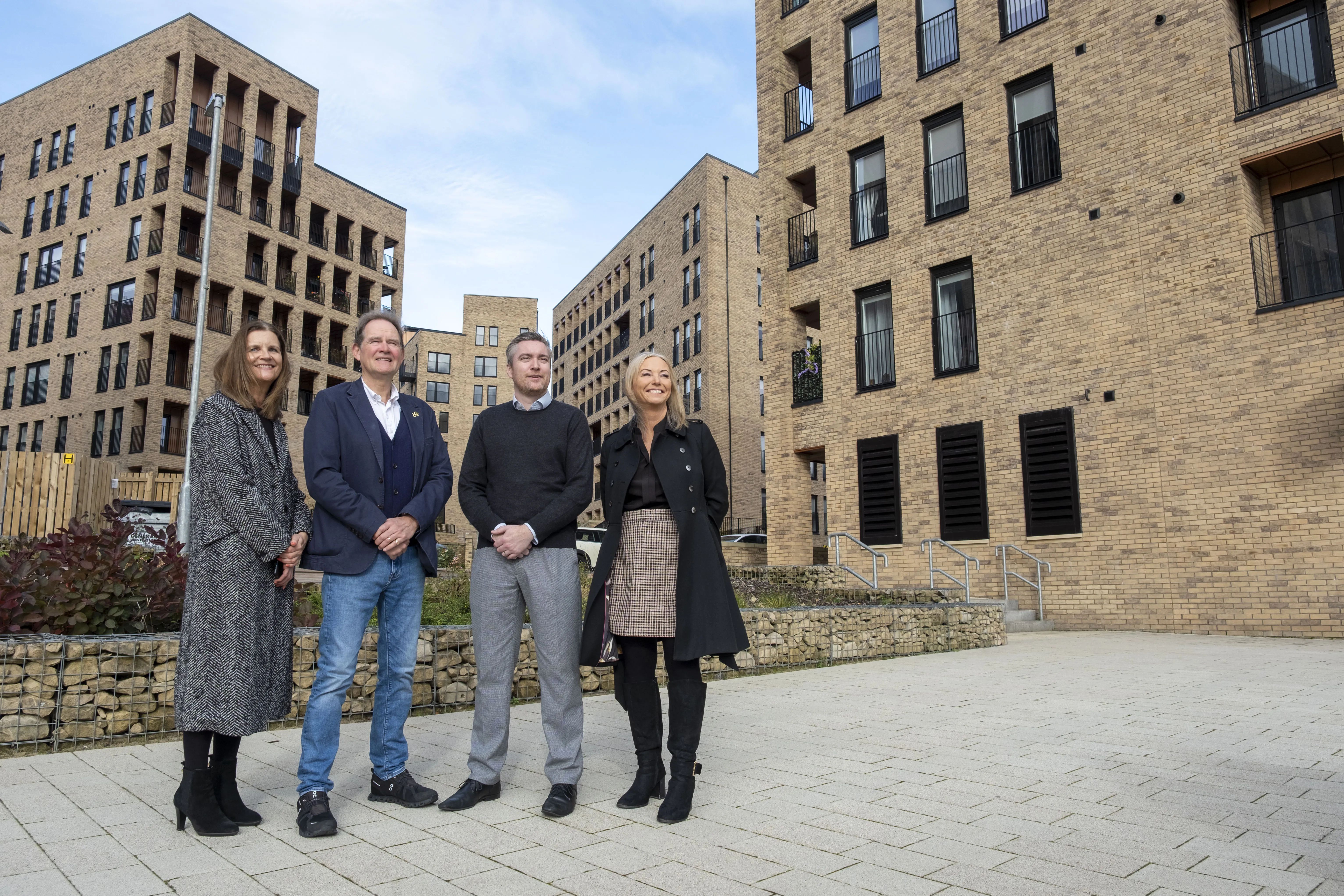 sanctuary staff in front of development