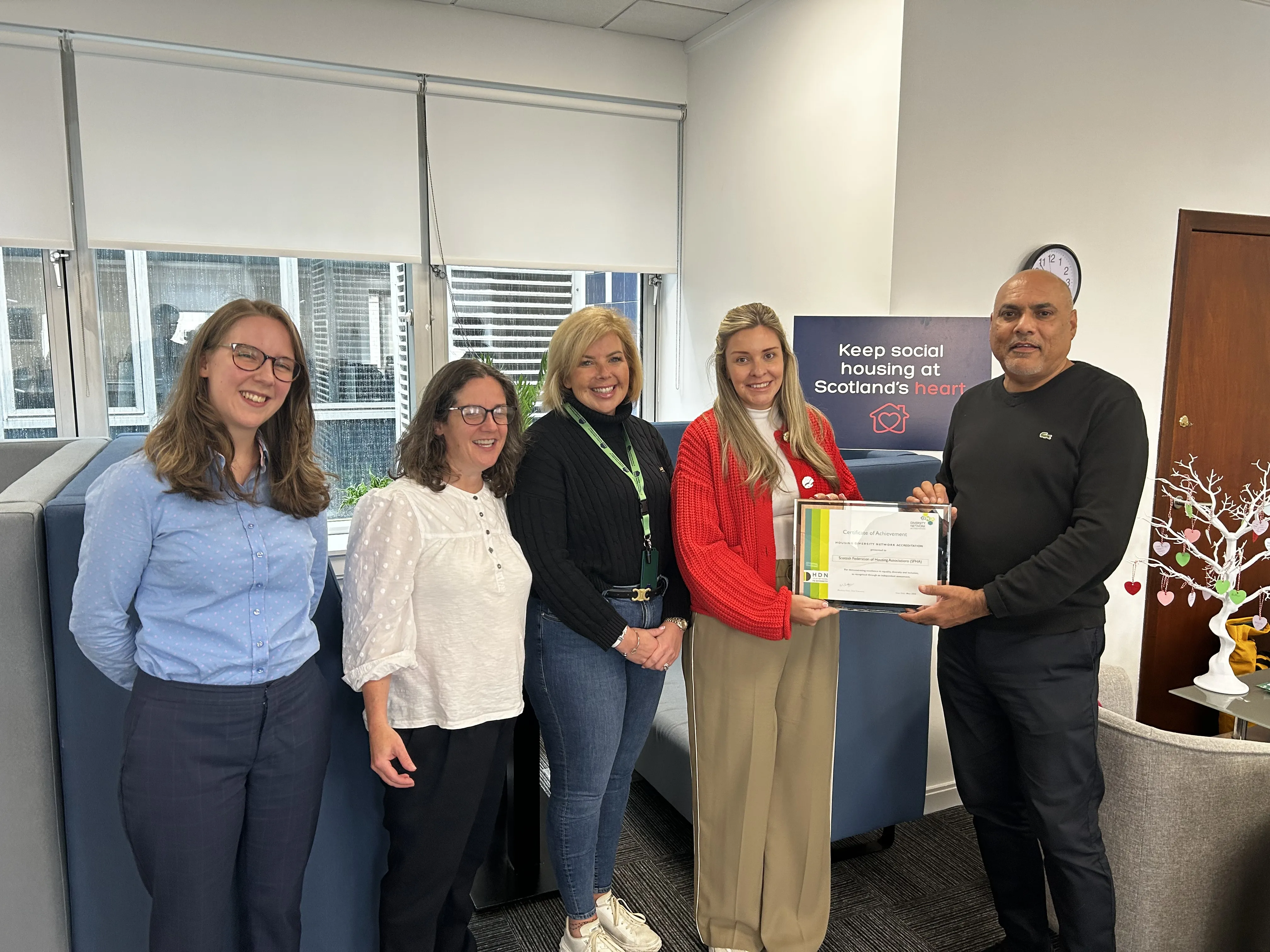 SFHA staff receiving HDN award for EDI accreditation