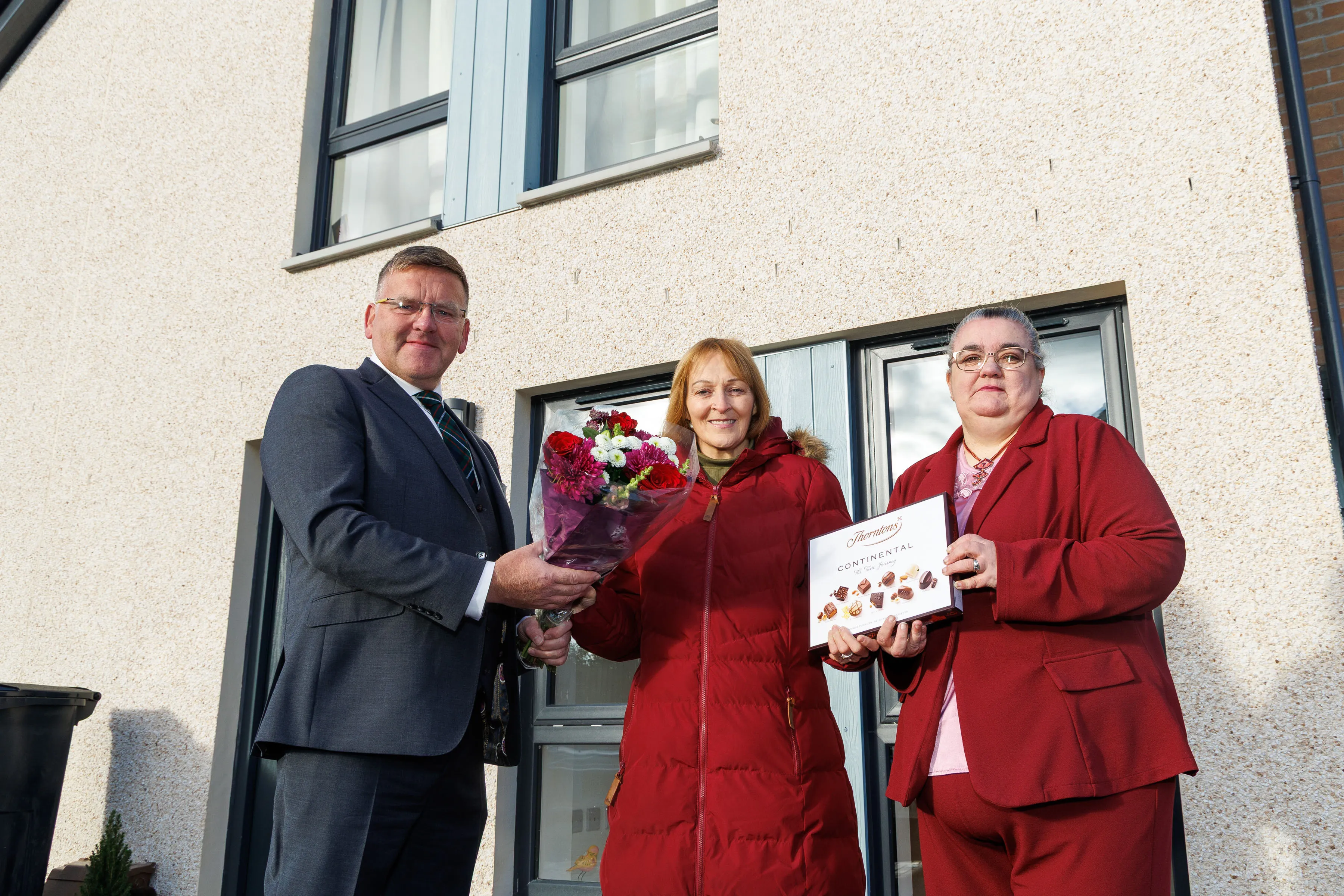 Councillor Willie Ferguson with new resident Jacqueline Buik (centre) and RSHA Chairperson Fiona Boath.
