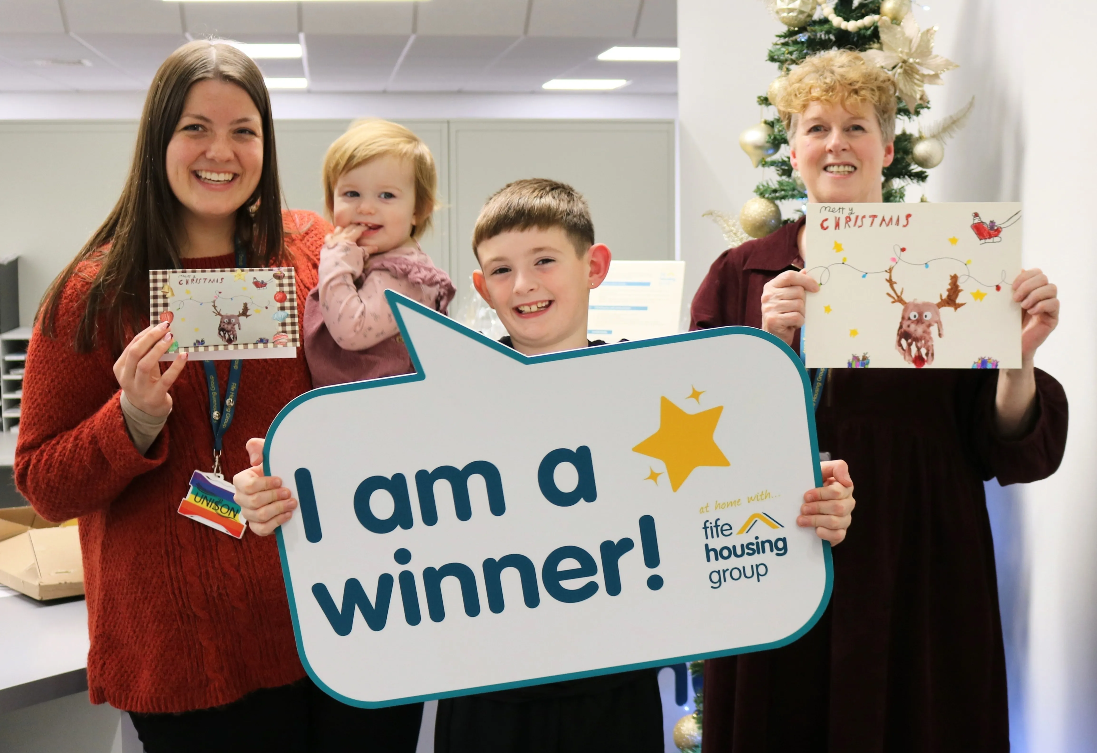 children's-christmas-card-competition-winners-ada-and-arlo-with-colleagues,-melissa-left)-and-carolyn-right