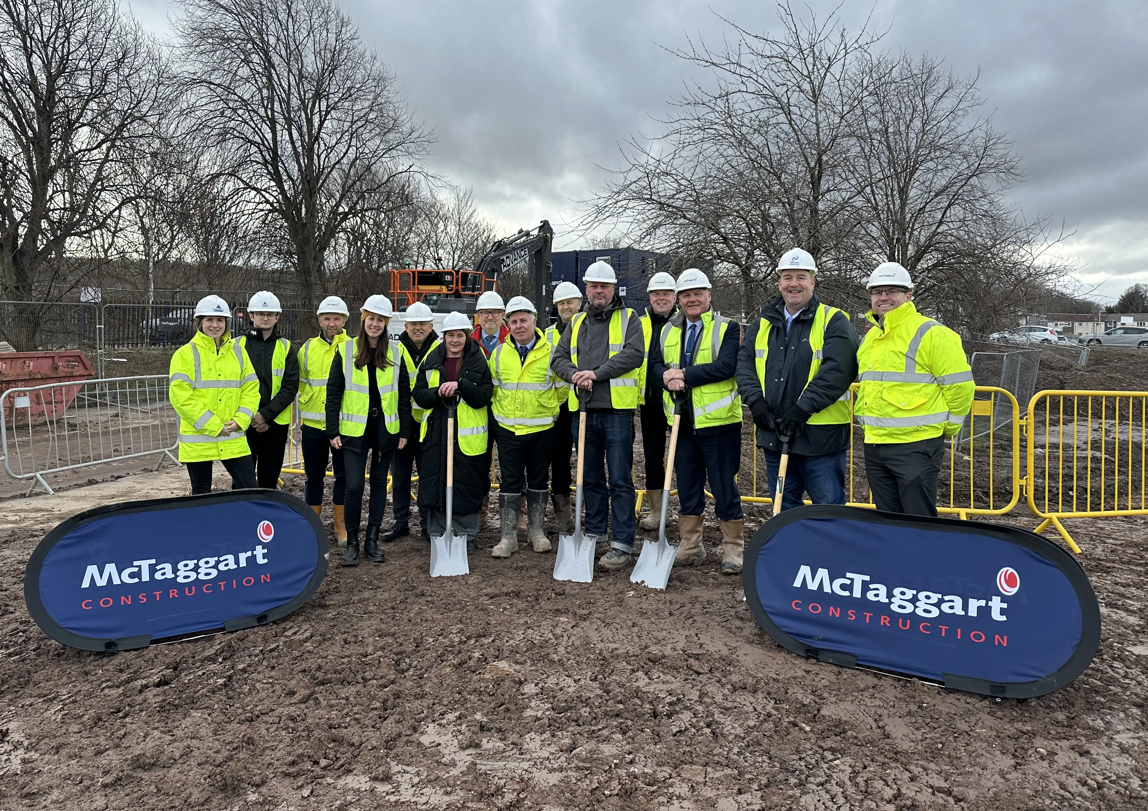 construction staff in hi vis jackets and hard hats
